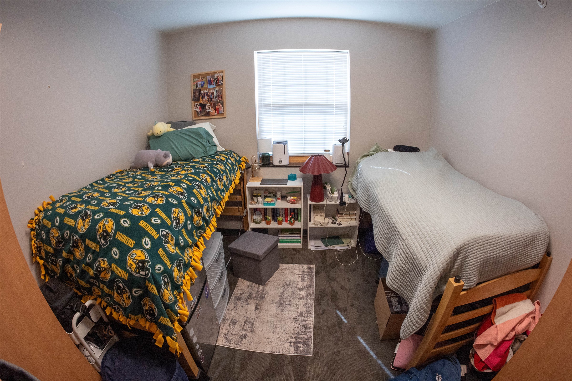  Interior of Richie Hall dorm room with two lofted beds with storage underneath 